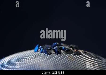 Closeup shot of coal on metal surface Stock Photo