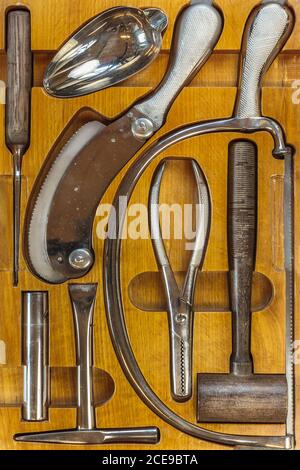 Ancient doctor wooden case with a set of surgical instruments Stock Photo