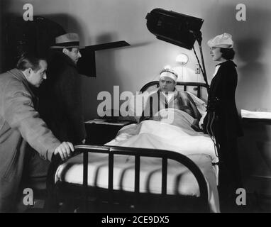 WILLIAM KEIGHLEY Cinematographer SOL POLITO JAMES CAGNEY and ANN DVORAK on set candid during filming of hospital scene in G MEN 1935 director WILLIAM KEIGHLEY story / screenplay Seton I. Miller casting consultant J. Edgar Hoover First National Pictures / Warner Bros. Stock Photo