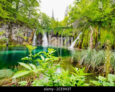 Colorful National park dreamy Plitvice lakes in Croatia Europe water flowing waterflow waterfall scenic scenery Stock Photo