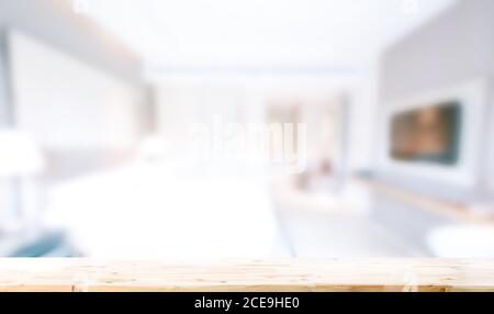blurred bedroom interior background and wooden table top in front for montage or display your products. Stock Photo