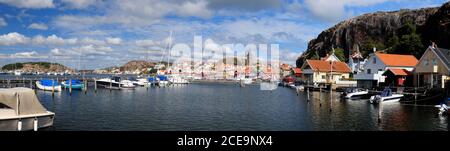 Panoramic View From The Harbour To Fjallbacka Town On A Sunny Summer Day With Some Clouds In The Sky Stock Photo