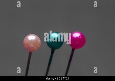pins with colorful isolated on black background Stock Photo