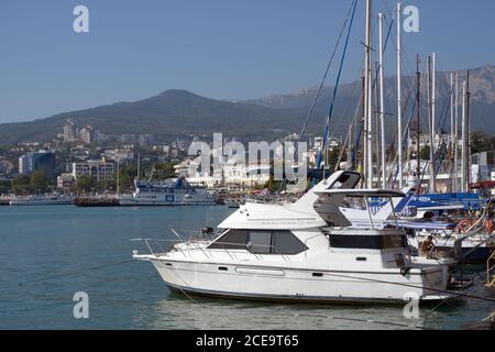 Yachts and boats moored at the sea embankment of Yalta, Crimea, Ukraine Stock Photo
