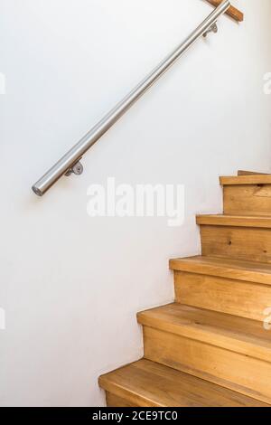 closed up of wooden stairs and railing in a home, details of a modern house Stock Photo