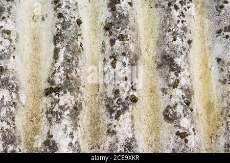 Rough stone wall with cracks of grey Stock Photo