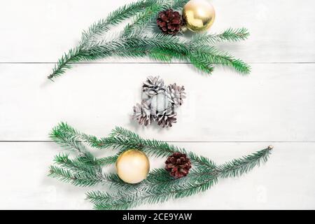 Christmas background with fir branches and pine cones covered with snow. Stock Photo