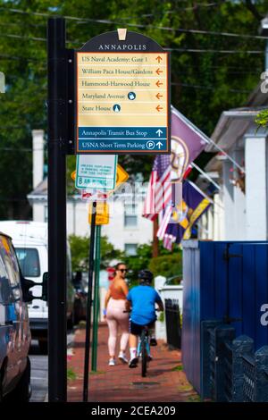 Annapolis, MD 08/21/2020: A close up  image of a sign post in historic district of Annapolis, Maryland which shows the directions of major landmarks i Stock Photo