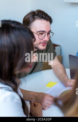 People listening to speaker in office Stock Photo