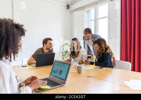 Colleagues discussing graphs Stock Photo