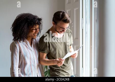 Woman listening to superior and making notes Stock Photo