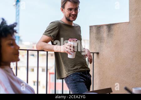 man leaning on fence Stock Photo