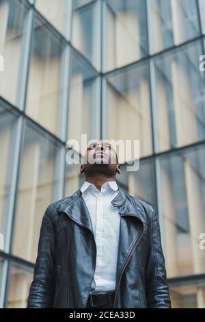 Handsome African-American male looking up Stock Photo