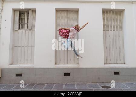 man jumping on street Stock Photo