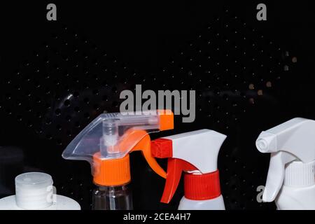 windows cleaning sprays. bottles with sprays for cleaning on the black background. Stock Photo