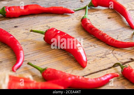 hot chili peppers on wooden background. selective focus.nature Stock Photo