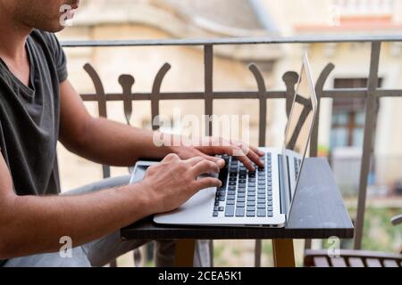man using laptop outdoors Stock Photo