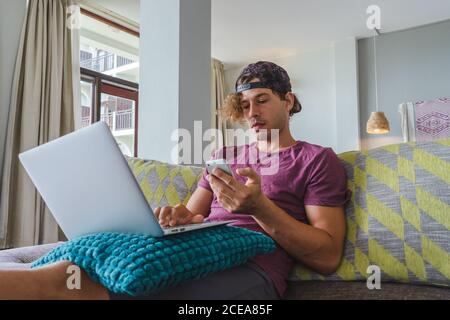 man resting and using laptop Stock Photo