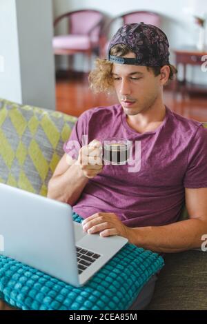 man resting and using laptop Stock Photo