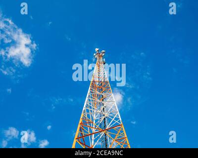 The tower of the mobile operator rushed into the blue sky. Forward to new technologies, 5th generation networks, the future is already near us! Stock Photo