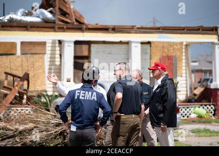 U.S. President Donald Trump visits a neighborhood damaged in Hurricane Laura August 29, 2020 in Lake Charles, Louisiana. Stock Photo