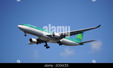 Aer Lingus Airbus A330-302 prepares for landing at Chicago O'Hare International Airport. The plane's registration is EI-FNH and has a retro livery. Stock Photo