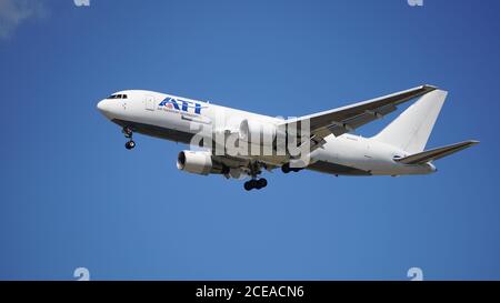 ATI (Air Transport International) Boeing 767 cargo plane prepares to land at Chicago O'Hare International Airport. Stock Photo