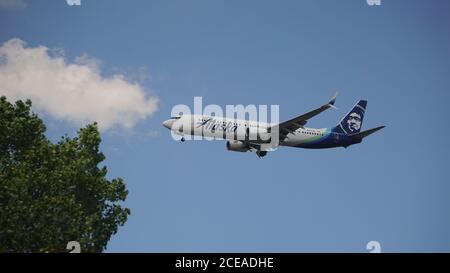 Alaska Airlines Boeing 737-900 prepares for landing at Chicago O'Hare International Airport. The plane's registration is N268AK. Stock Photo