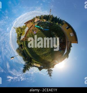 Panoramic view from drone, small planet and blue sky around the globe Stock Photo
