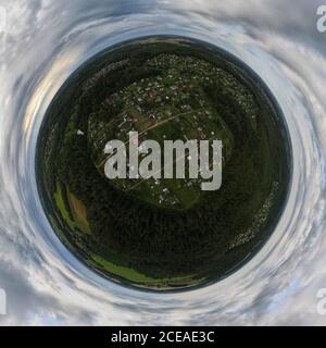 Panoramic view from drone, small planet and blue sky around the globe Stock Photo