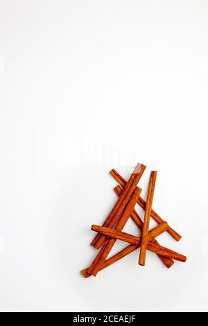 Cinnamon sticks arranged on a white background Stock Photo