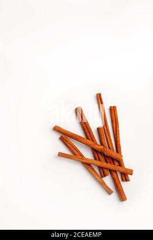 Cinnamon sticks arranged on a white background Stock Photo