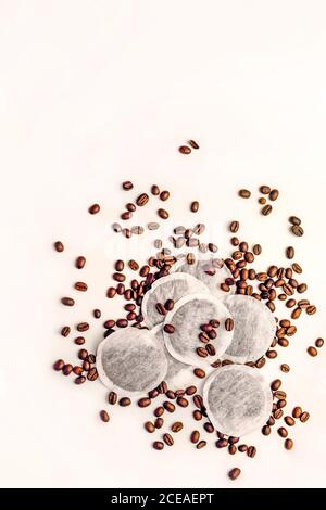Coffee beans and tea bags on a white background