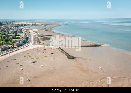 Low tide sandy beach at bright sunny day.  Morecambe in Lancashire, United Kingdom Stock Photo