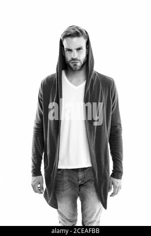 Male fashion influencer. Fashionable young model man. Carefree guy street  style outfit with hood. Handsome man with hood standing urban background.  Fashion trend. Comfortable clothes for daily wear Stock Photo