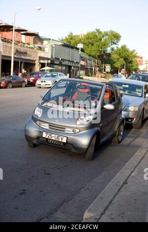 Austin, TX May 8, 2008: A Smart Car sits parked on west Sixth Street in downtown Austin. Record-high gas prices have commuters looking for alternative transportation to traditional cars. ©Bob Daemmrich Stock Photo