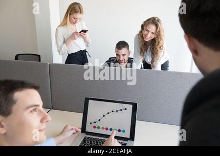 Group of colleagues working in contemporary office Stock Photo
