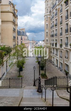 Paris, typical staircase and street, beautiful buildings in Montmartre Stock Photo