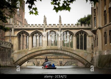 A Punt approaches the Bridge of Sighs along the river Cam at St John's College at  the University of Cambridge.