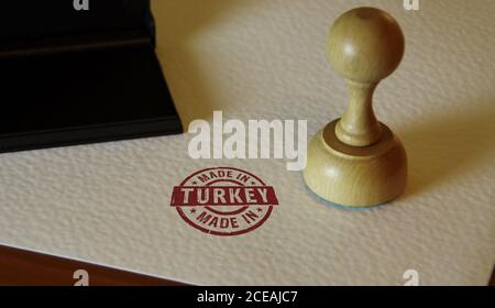 Made in Turkey stamp and stamping hand. Factory, manufacturing and production country concept. Stock Photo