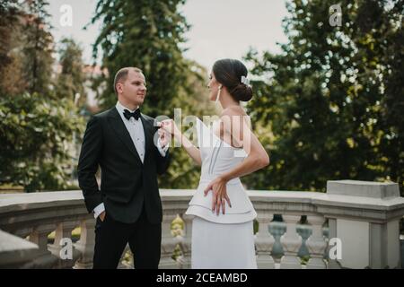 Young bride posing near groom Stock Photo