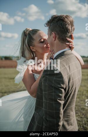Bride and groom looking each other before to kiss Stock Photo