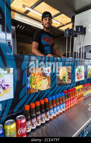 The cook in a mobile food vender truck in Tijuana, Mexico. Stock Photo