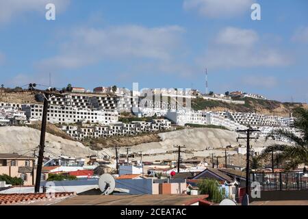 New apartment blocks in Tijuana are being built to accommodate workers coming to work in manufacturing plants built by U.S. companies in Mexico. Stock Photo