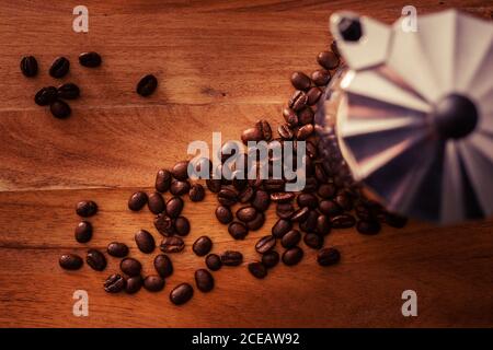 Coffee beans near brewing pot Stock Photo