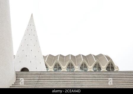 VALENCIA, SPAIN - NOVEMBER, 8 , 2018: Various unusual structures standing on steps against white sky in City of Art and Sciences in Valencia, Spain Stock Photo