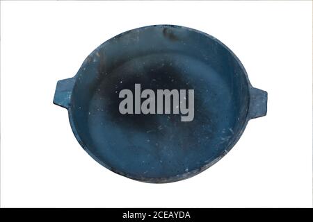 Old smoked cast iron frying pan isolate on a white background close-up. Stock Photo