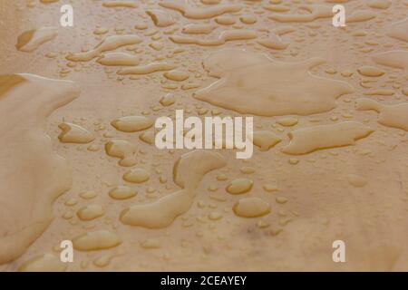 Wet wood background, water drops on plywood surface after the rain Stock Photo