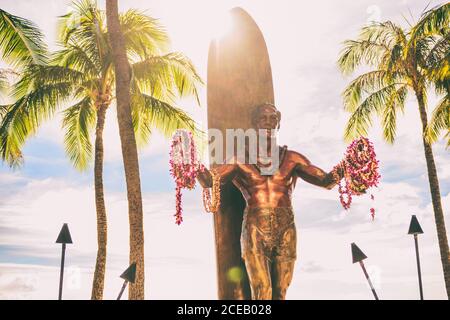 Waikiki Beach Honolulu, statue of Duke Kahanamoku. Travel on Oahu, Hawaii. Famous tourist attraction and surfing landmark in the USA. Sunshine Stock Photo