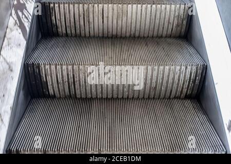 Empty steps of an escalator in a perspective view Stock Photo